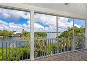 View of Canal and ICW from the Great Room/Living Area. - Single Family Home for sale at 62 Tarpon Way, Placida, FL 33946 - MLS Number is D6121925