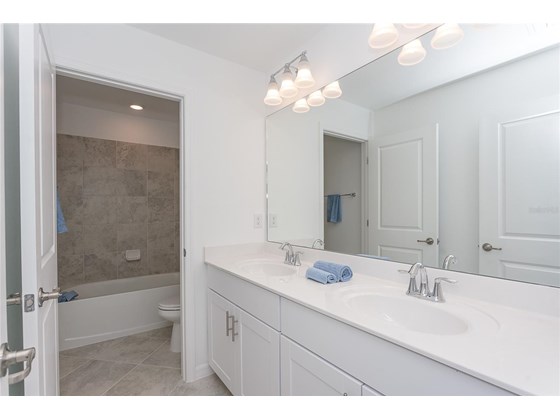 2nd floor bathroom,dual sinks, separate water closet and shower/tub - Single Family Home for sale at 1837 East Isles Rd, Port Charlotte, FL 33953 - MLS Number is D6122330
