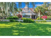 Lush gardens surround the estate - Single Family Home for sale at 5030 Sunrise Dr S, St Petersburg, FL 33705 - MLS Number is U8146766