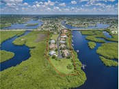 Lea Marie Island is an exclusive private subdivision situated in a natural estuary adjacent to Charlotte Harbor in beautiful Southwest Florida. Direct sailboat access from East Spring Waterway to Charlotte Harbor and on to the Gulf of Mexico makes this a very desirable place to live. All drone pictures were taken in July of 2018. - Vacant Land for sale at 4030 Lea Marie Island Dr, Port Charlotte, FL 33952 - MLS Number is C7404124