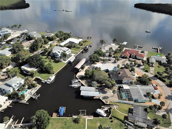 Sailboat access to Lemon Bay only minutes to Stump Pass - Single Family Home for sale at 1345 Holiday Dr, Englewood, FL 34223 - MLS Number is C7449205