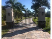 Private gated entrance to paved 800' driveway - Single Family Home for sale at 2755 Cussell Dr, Saint James City, FL 33956 - MLS Number is C7451799