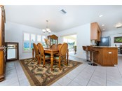 DINING ROOM WITH PLANTATION SHUTTERS, SLIDERS TO LANAI, COULD BE USED AS A FAMILY ROOM AS WELL - Single Family Home for sale at 3400 Colony Ct, Punta Gorda, FL 33950 - MLS Number is C7451906