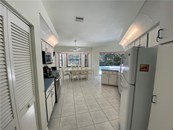 Standing in the kitchen. The panty is to the left. - Single Family Home for sale at 18506 Hottelet Cir, Port Charlotte, FL 33948 - MLS Number is C7452138