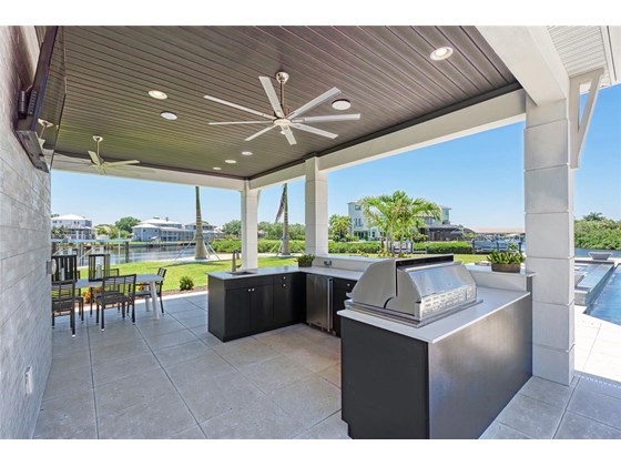 Cabana includes full outdoor kitchen, perfect for entertaining your family and friends! Even plenty of room for your outdoor dining table and chairs at the cabana. - Single Family Home for sale at 602 Regatta Way, Bradenton, FL 34208 - MLS Number is A4499642