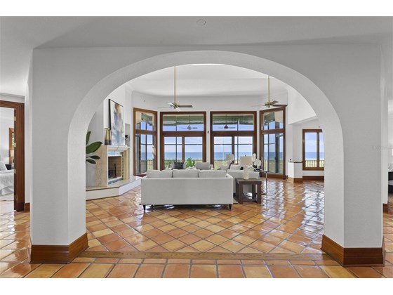 Arched columns entering into the great room - Single Family Home for sale at 6211 Gulf Of Mexico Dr, Longboat Key, FL 34228 - MLS Number is A4511733