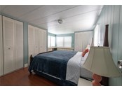 Bedroom, walk in closets - Single Family Home for sale at 104 Portia St N, Nokomis, FL 34275 - MLS Number is A4514916