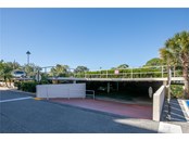 View of entrance to your covered parking.  There is an abundance of guest parking on the top, open level - Condo for sale at 244 Saint Augustine Ave #104, Venice, FL 34285 - MLS Number is A4518081