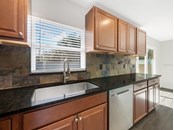 Stunning granite countertops and wood cabinets. - Single Family Home for sale at 3070 Hatton St, Sarasota, FL 34237 - MLS Number is A4518301