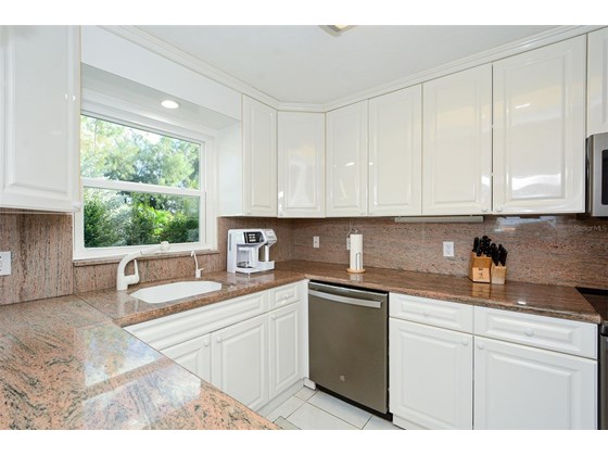 Light, Bright kitchen with greenbelt views ...And brand new hurricane rated windows! - Condo for sale at 450 Gulf Of Mexico Dr #B107, Longboat Key, FL 34228 - MLS Number is A4520786
