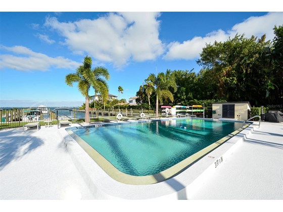 Spacious pool deck, grill, kayak storage and kayak launch  Assigned boat docks. One bridge to Gulf - Condo for sale at 450 Gulf Of Mexico Dr #B107, Longboat Key, FL 34228 - MLS Number is A4520786