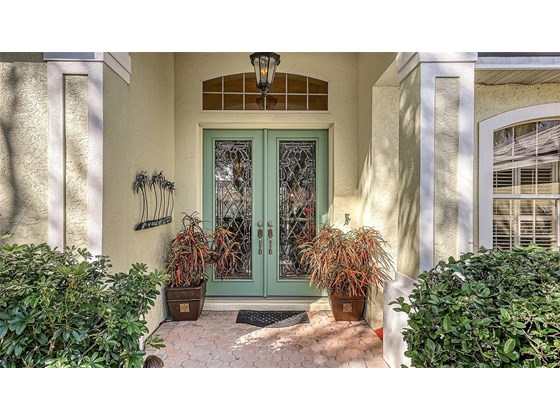 Enter in through the captivating leaded double glass front doors. - Single Family Home for sale at 8821 Misty Creek Dr, Sarasota, FL 34241 - MLS Number is A4521942