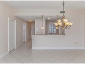 Dining room to kitchen with breakfast bar - Condo for sale at 147 Tampa Ave E #702, Venice, FL 34285 - MLS Number is N6116949