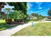 sidewalk in front of house - Single Family Home for sale at 314 Lake Tahoe Ct, Englewood, FL 34223 - MLS Number is N6117592
