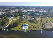 Mariners Landing from the air, home is in center behind pool - Single Family Home for sale at 6751 Portside Ln, Englewood, FL 34223 - MLS Number is N6118322
